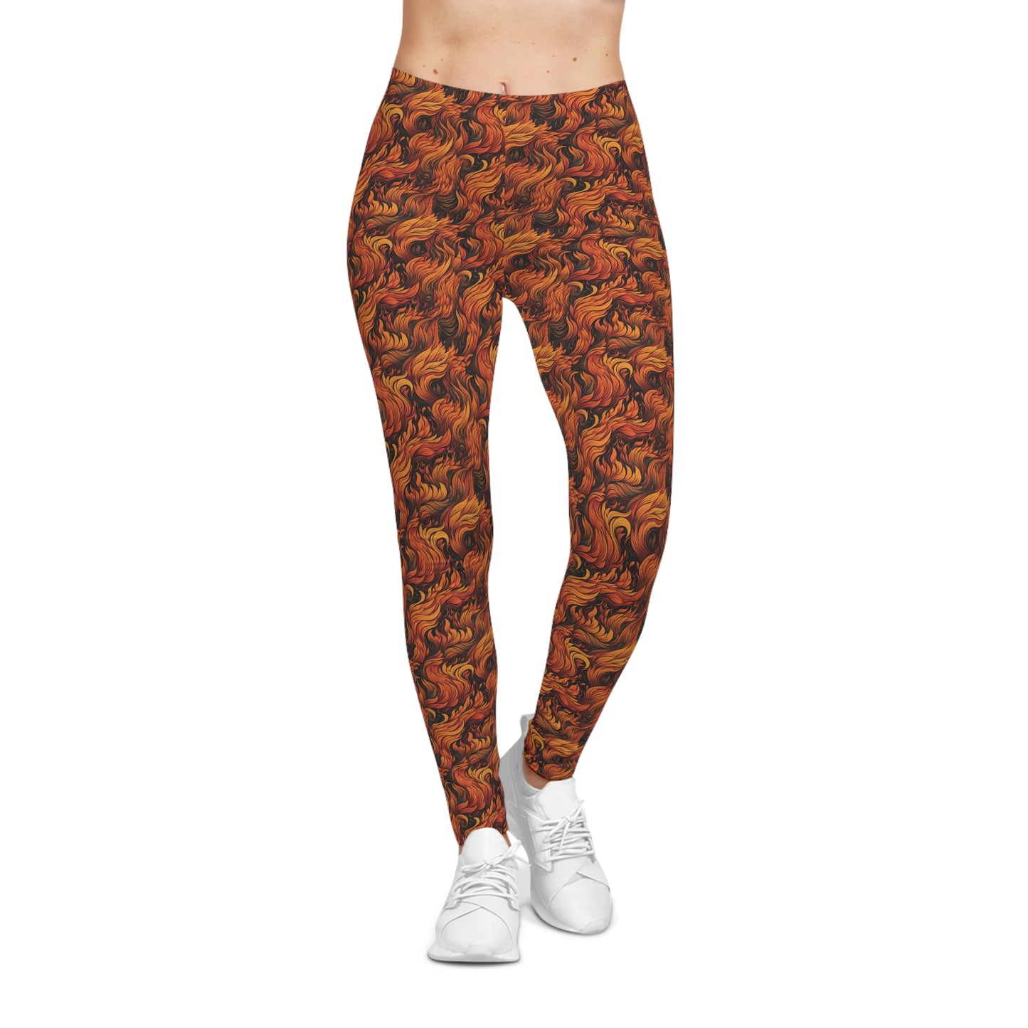 Front view of a woman wearing low rise leggings with a fire and flames all-over-print.