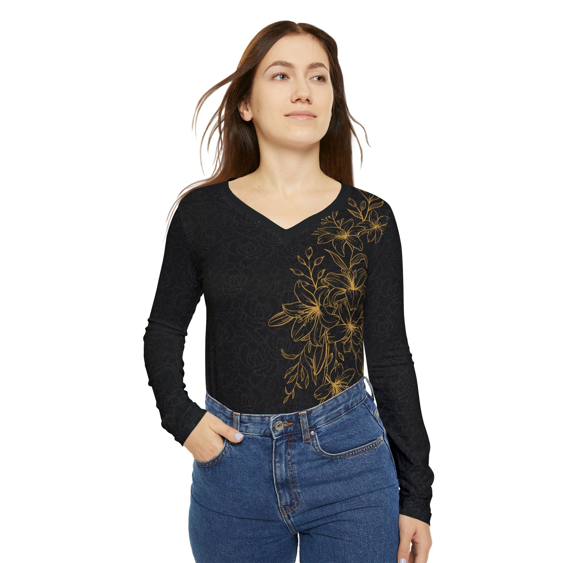 Alternate front view of a woman wearing a black, patterned long sleeve v-neck shirt with a gold, floral print covering the left size of the shirt.