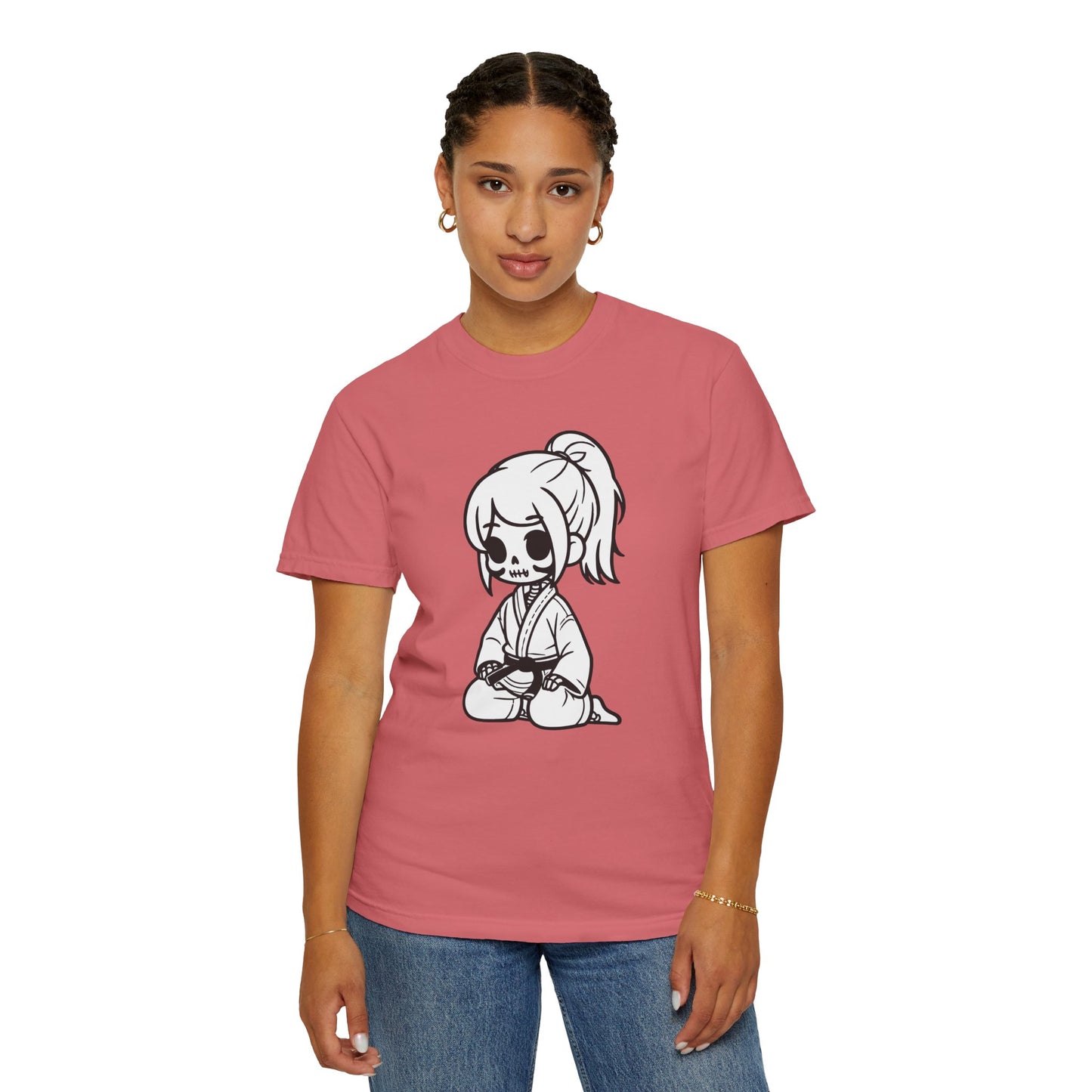 Front view of a woman wearing a Watermelon colored cotton t-shirt, with a design of a skeleton girl wearing a jiu jitsu gi printed on the front of the shirt.