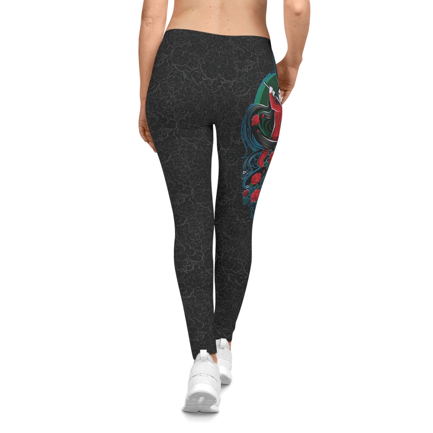 Back view of black, low-rise casual leggings with a light background pattern. Printed on the right, upper hip area is an illustration of a female warrior holding a katana sword.