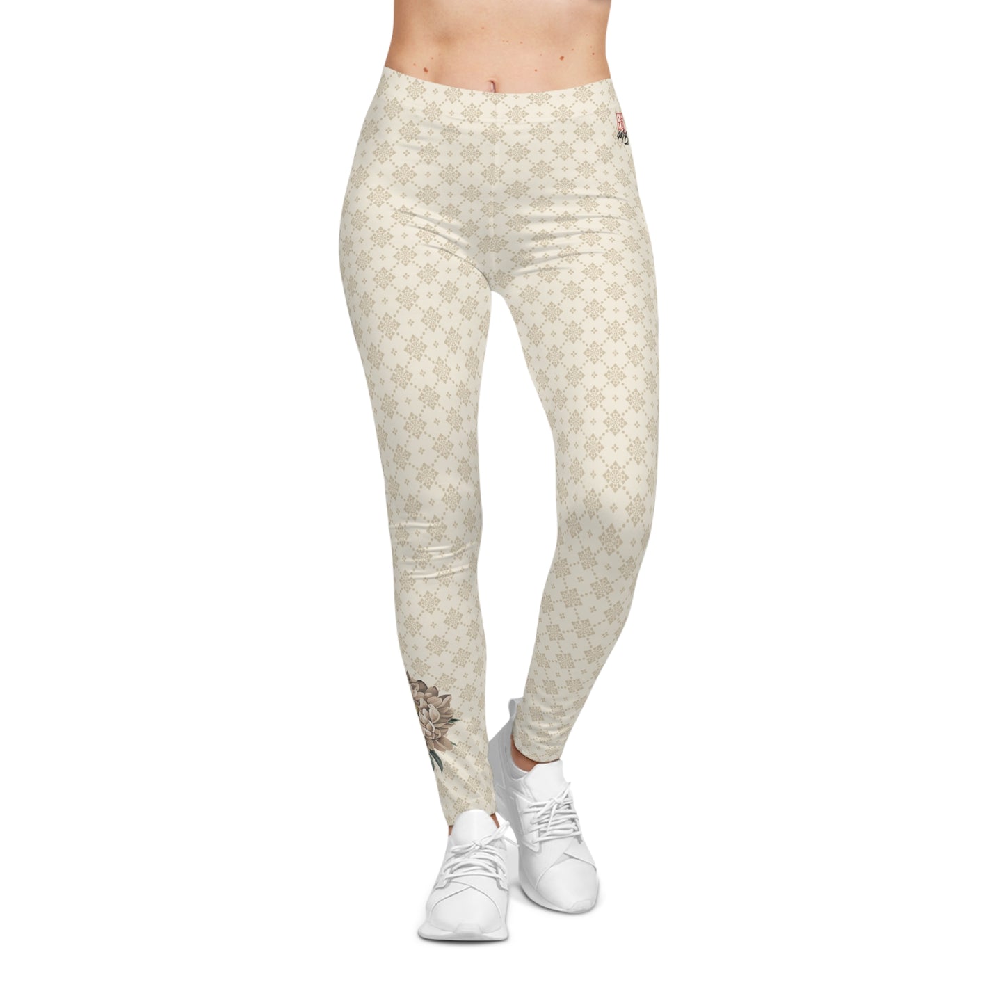 Front view of a woman wearing off-white colored patterned leggings, with a flower printed on the lower calf area of the right leg.