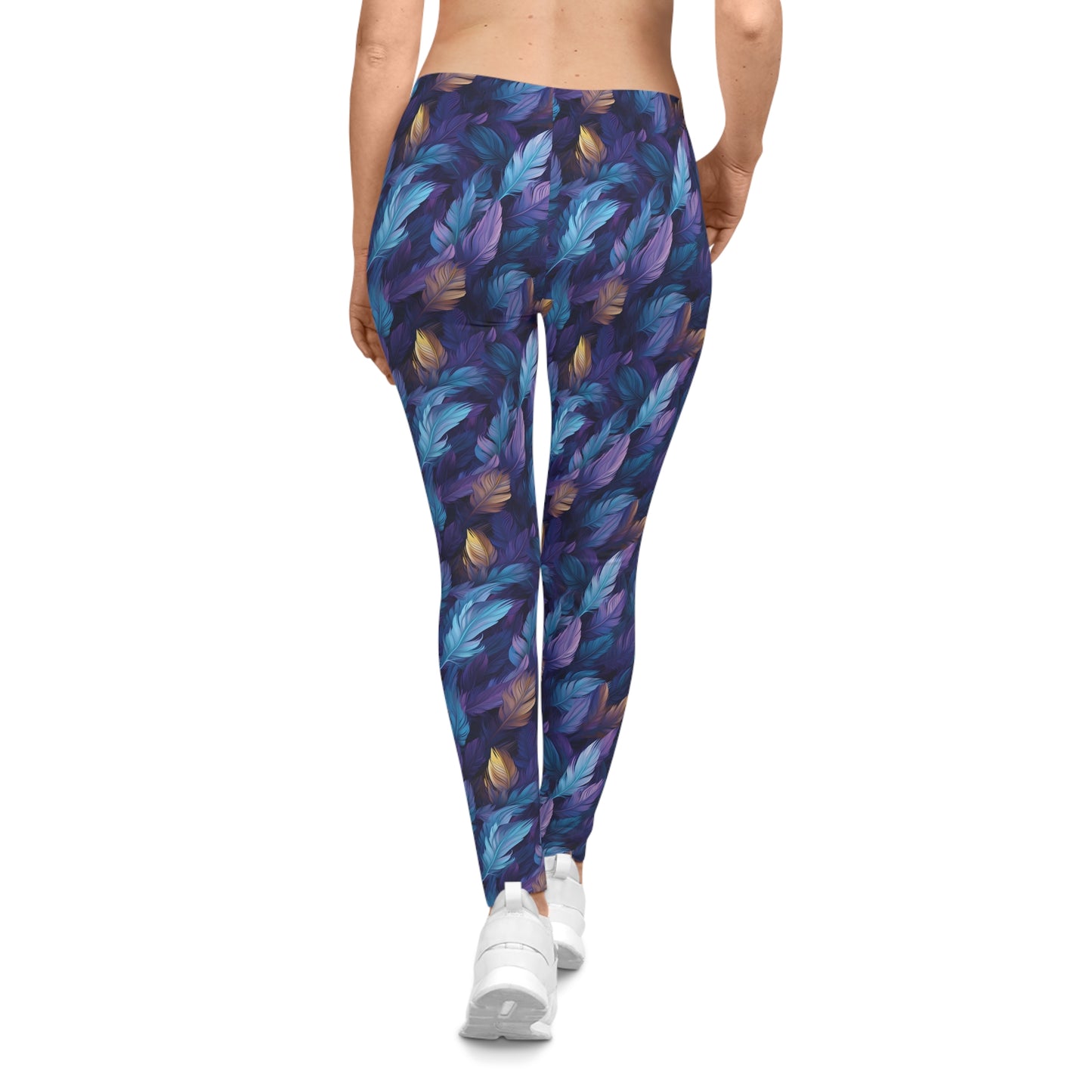 Back view of a woman wearing low rise leggings with a blue and purple feather print.