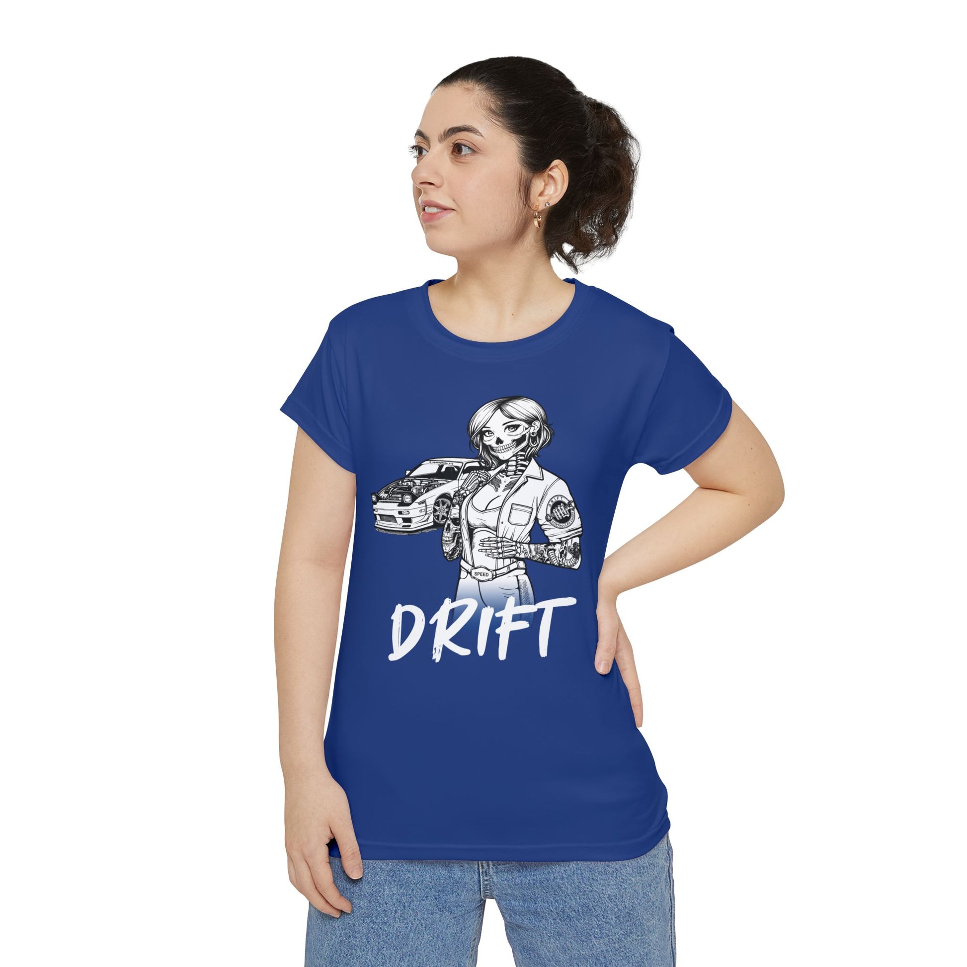 Front view of a woman wearing a dark blue, polyester blend t-shirt, with a design of a female skeleton dressed as a mechanic. The mechanic is standing next to her car with the word "Drift" written underneath.