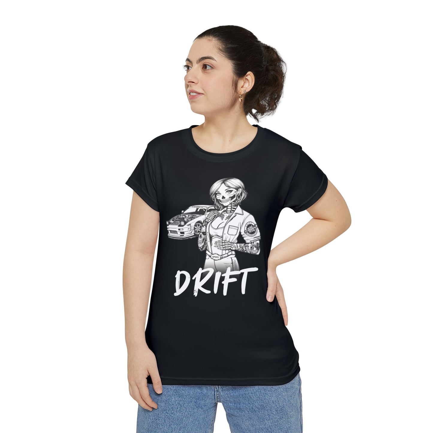 Front view of a woman wearing a black, polyester blend t-shirt, with a design of a female skeleton dressed as a mechanic. The mechanic is standing next to her car with the word "Drift" written underneath.