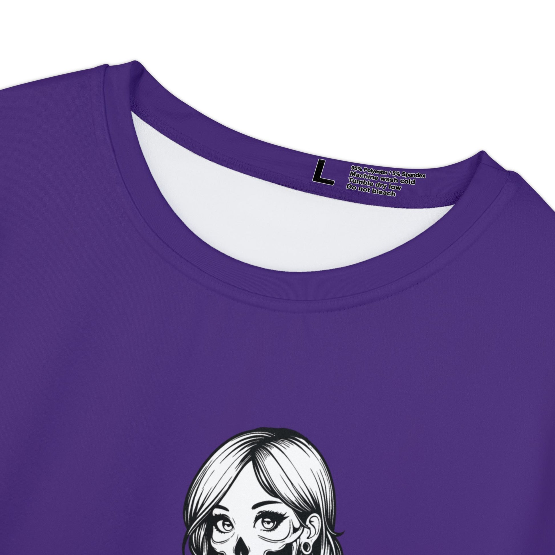 Close up view of the crew neck and care instructions of a purple, polyester blend women's t-shirt.