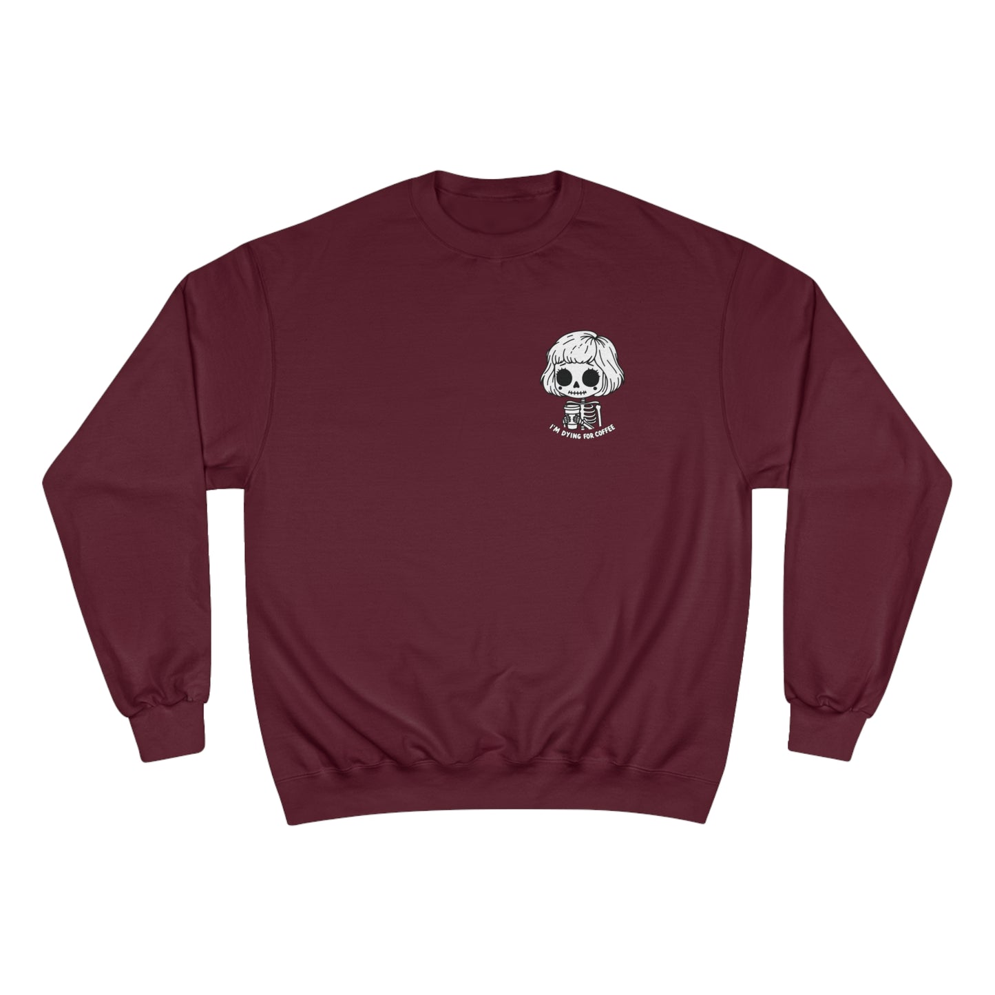 Front view of a maroon colored sweatshirt with a design of a skeleton girl holding a cup of coffee. Written underneath is the text "I'm dying for coffee". The design is placed on the left chest area of the sweatshirt.