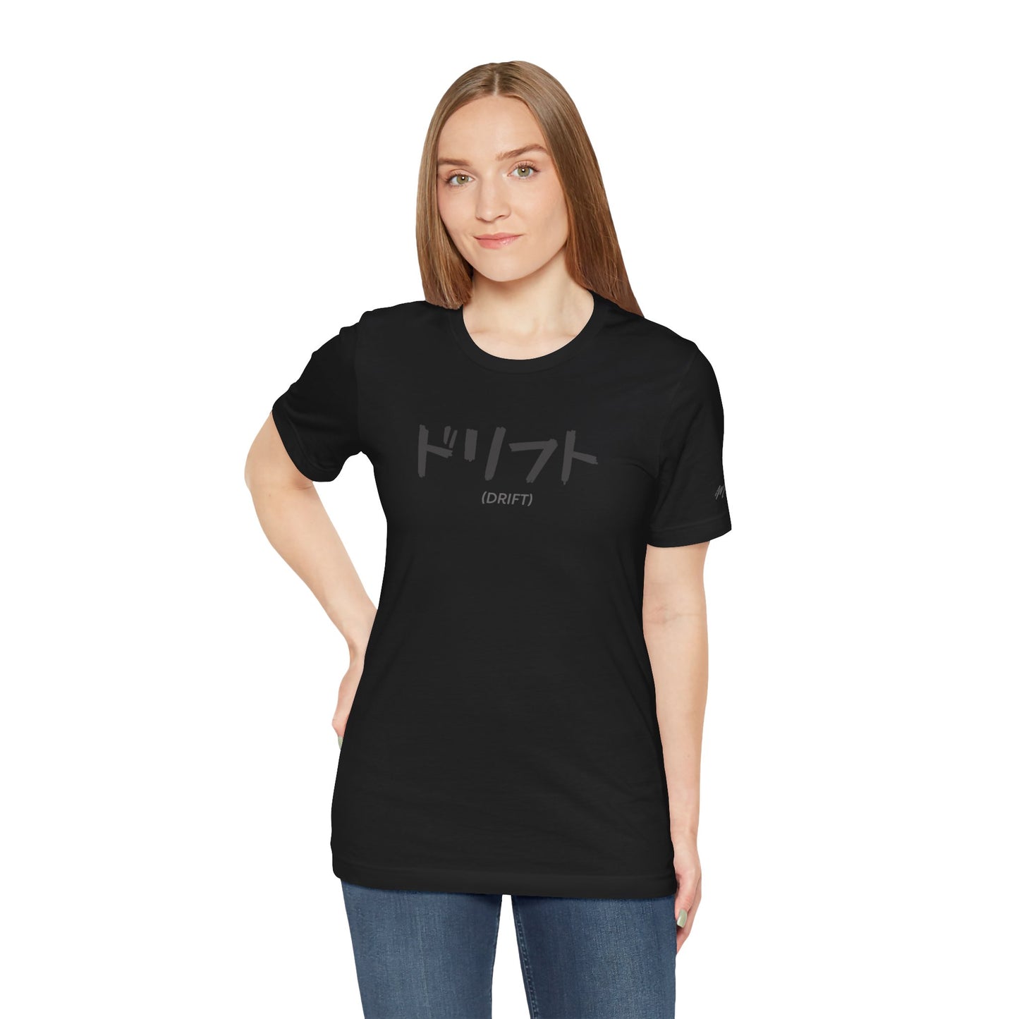 Alternate front view of a woman wearing a black t-shirt with text printed on the chest that spells Drift in Japanese.