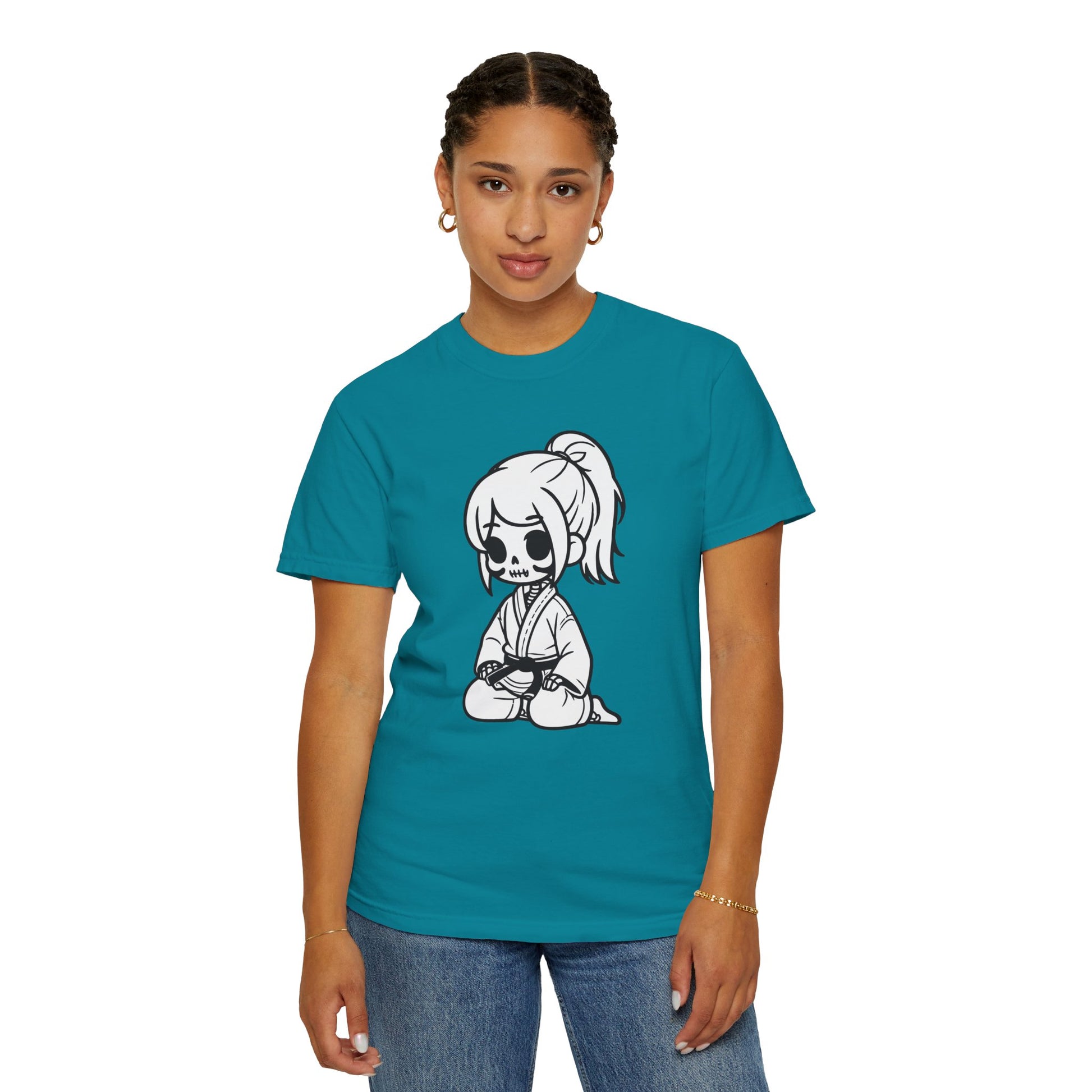 Front view of a woman wearing a Topaz Blue cotton t-shirt, with a design of a skeleton girl wearing a jiu jitsu gi printed on the front of the shirt.