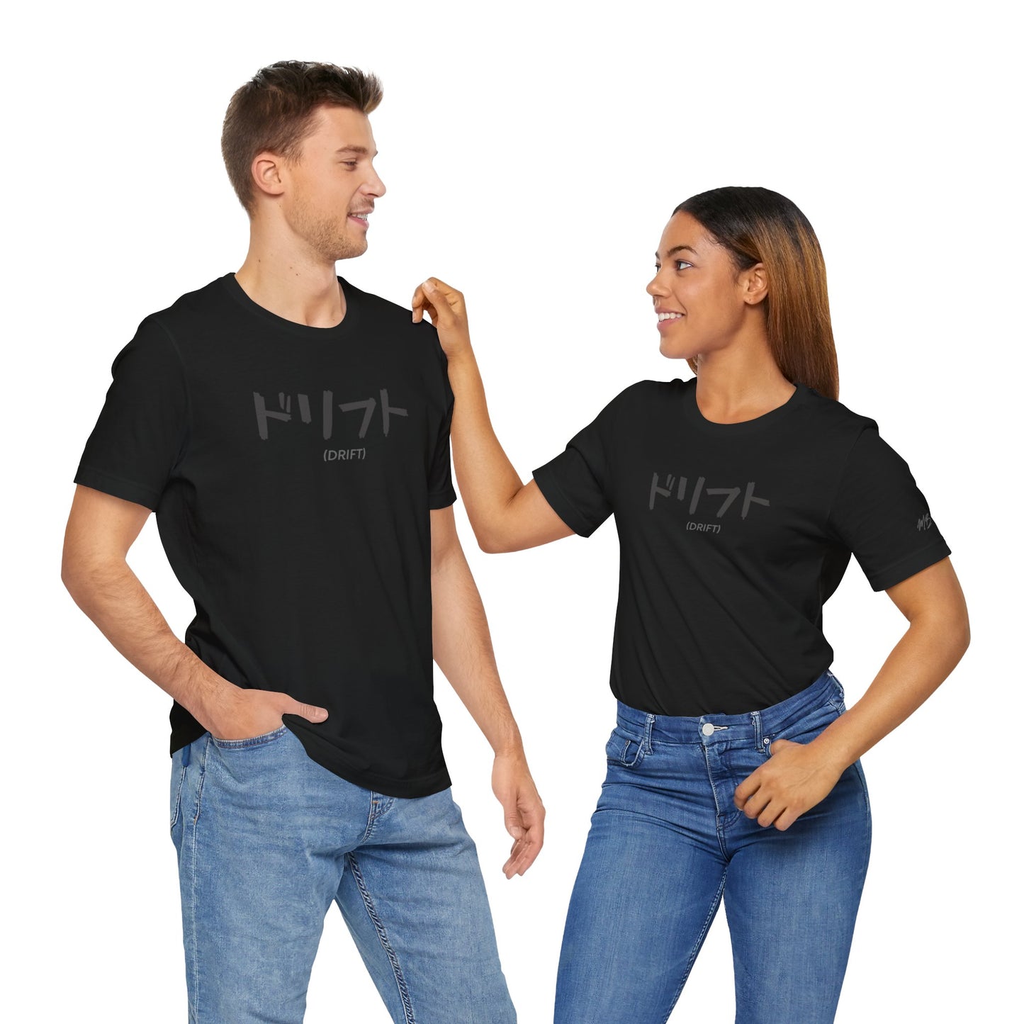 A man and woman wearing black t-shirts with text printed on the chest that spells Drift in Japanese.