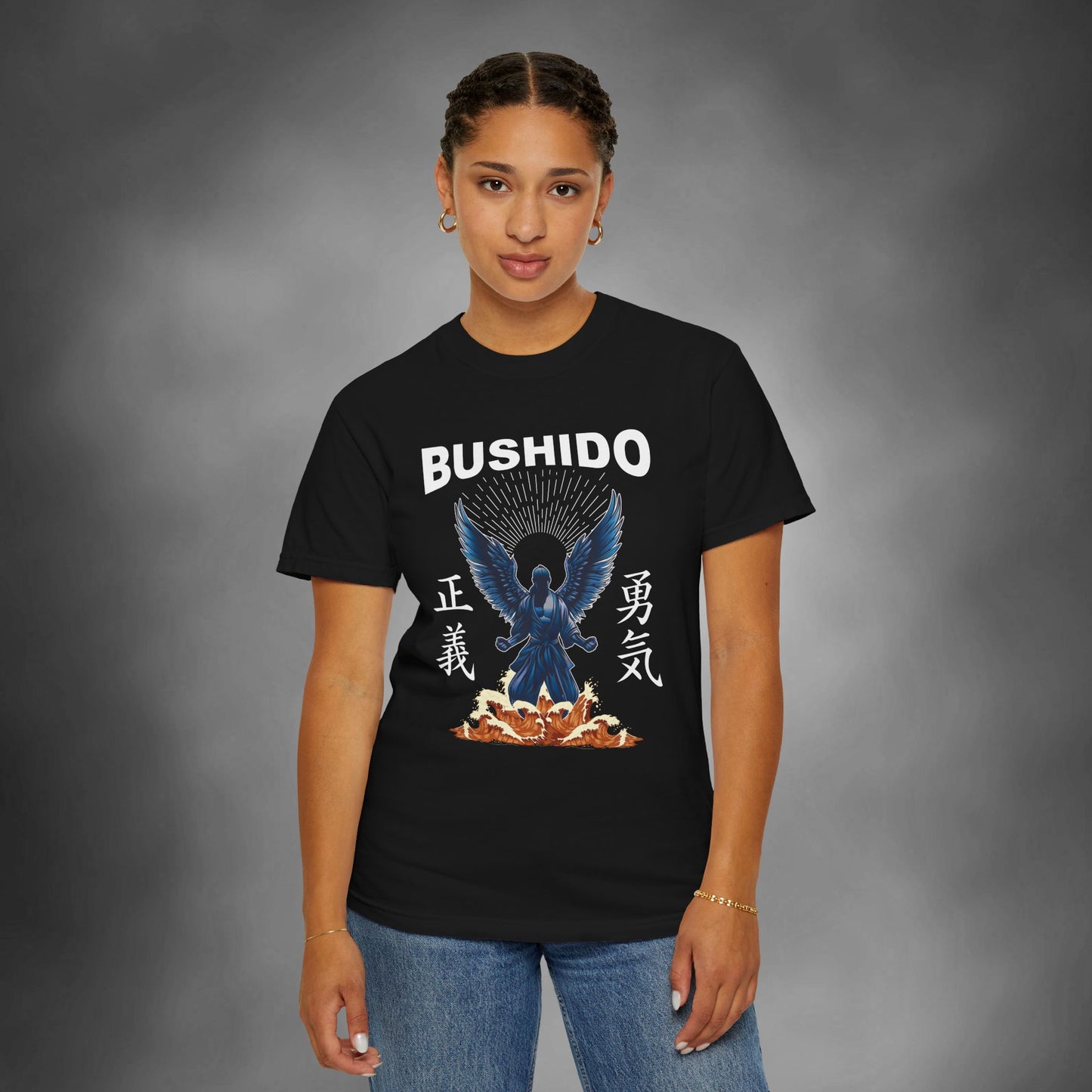 Woman wearing a black cotton t-shirt, with an illustration of a martial artist with angel wings. The text above the design reads "Bushido", and the kanji on the left and right sides are translated to English as "Justice" and "Courage".