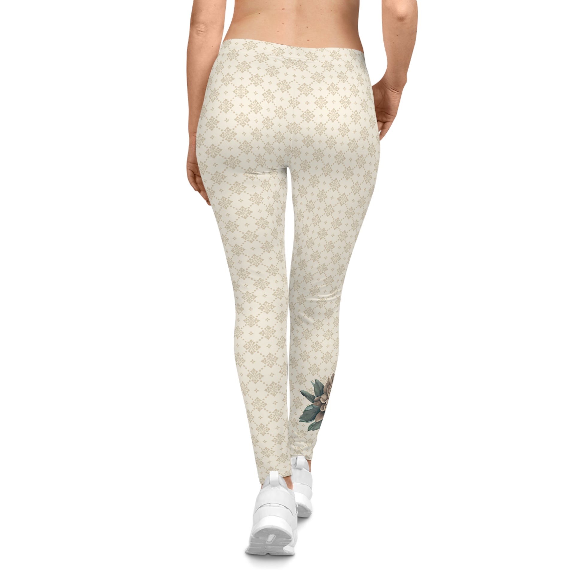 Back view of a woman wearing off-white colored patterned leggings, with a flower printed on the lower calf area of the right leg.