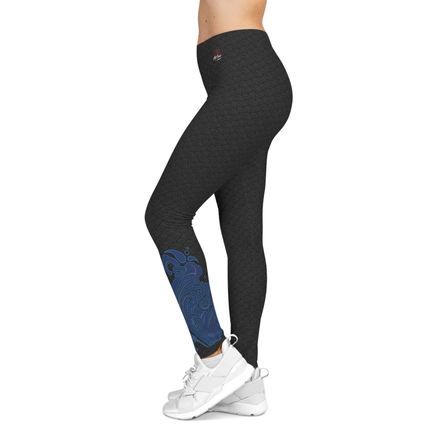 Left side view of black, patterned low-rise leggings, with an abstract design on the outer left calf area.