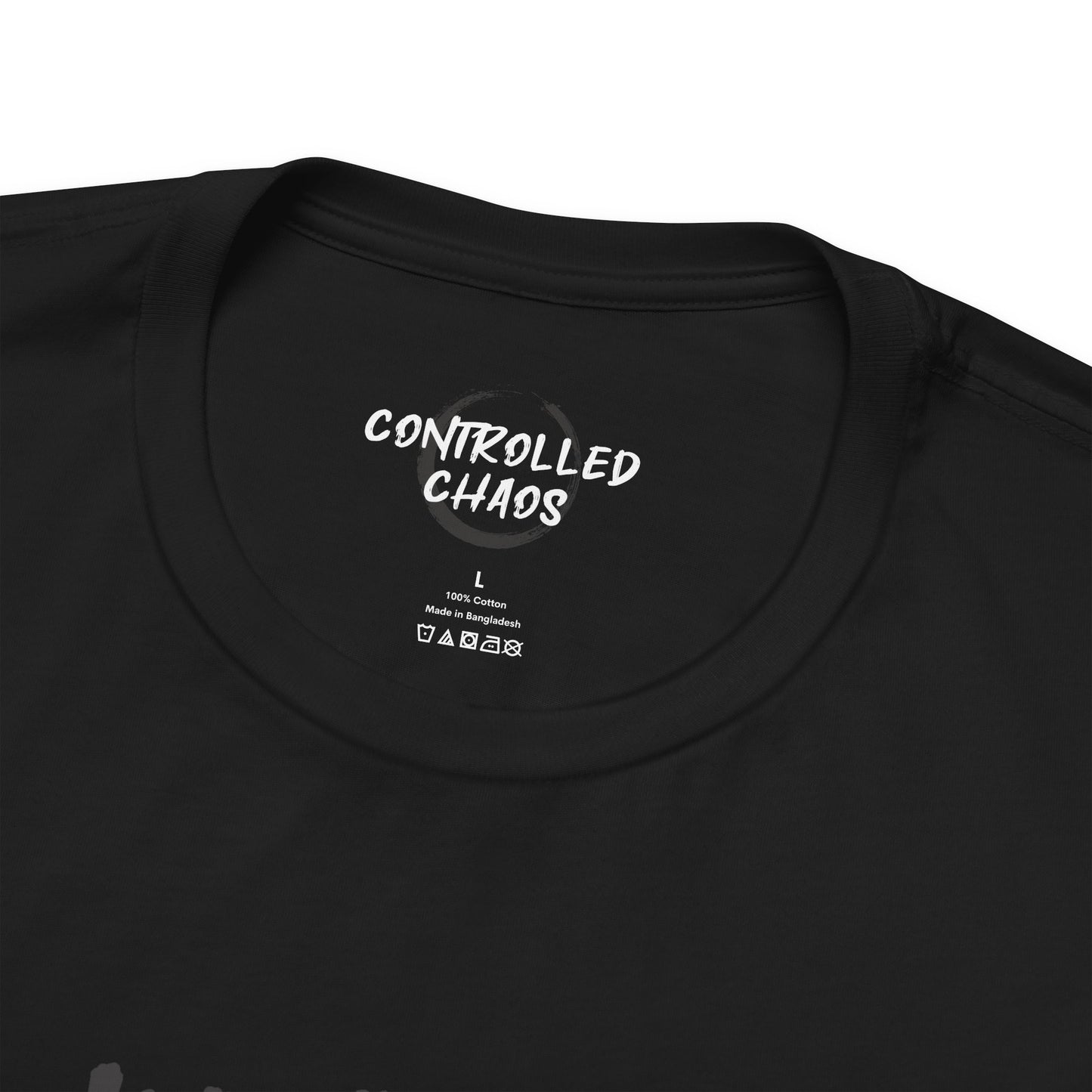 Close up view of the crew neck of a black t-shirt.