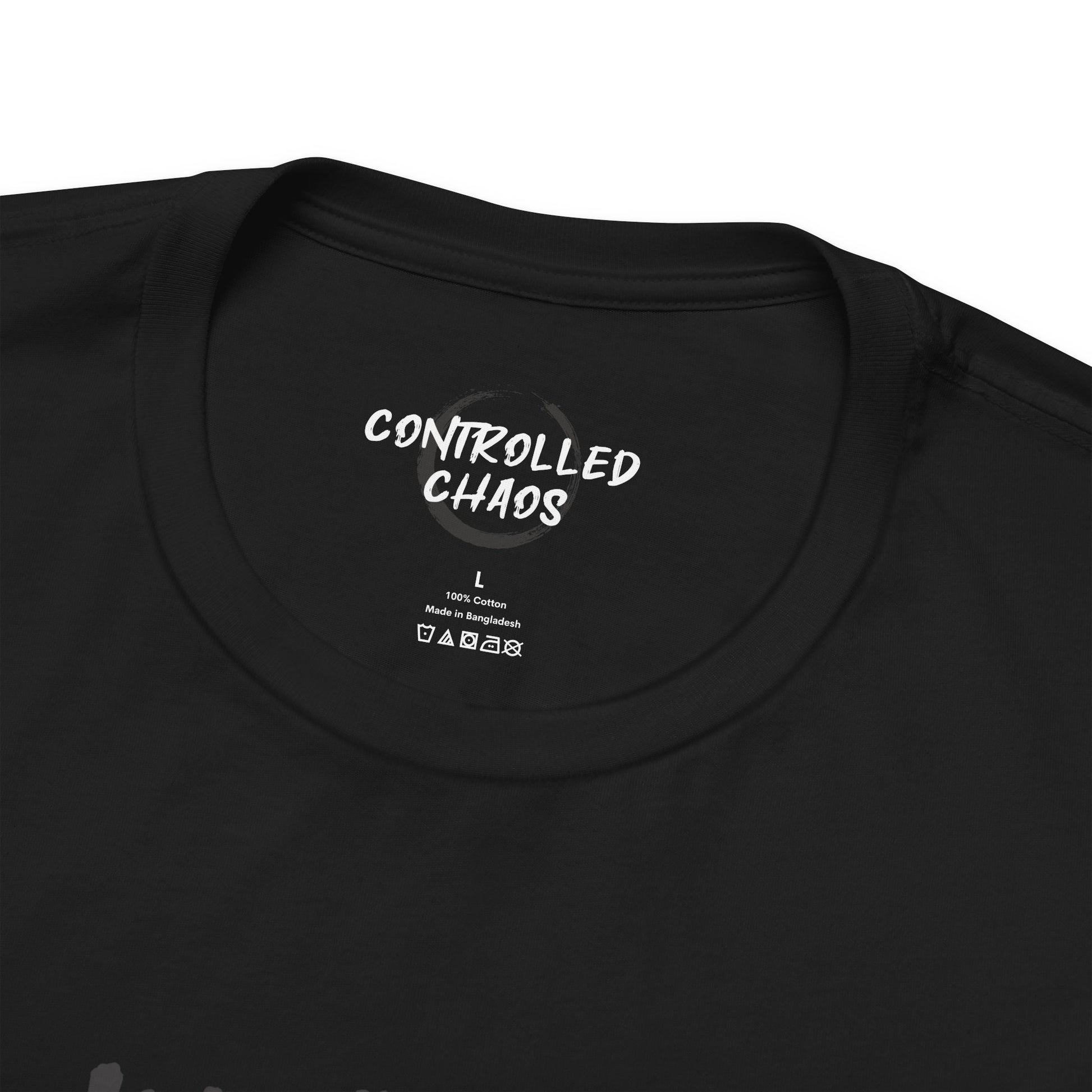 Close up view of the crew neck of a black t-shirt.