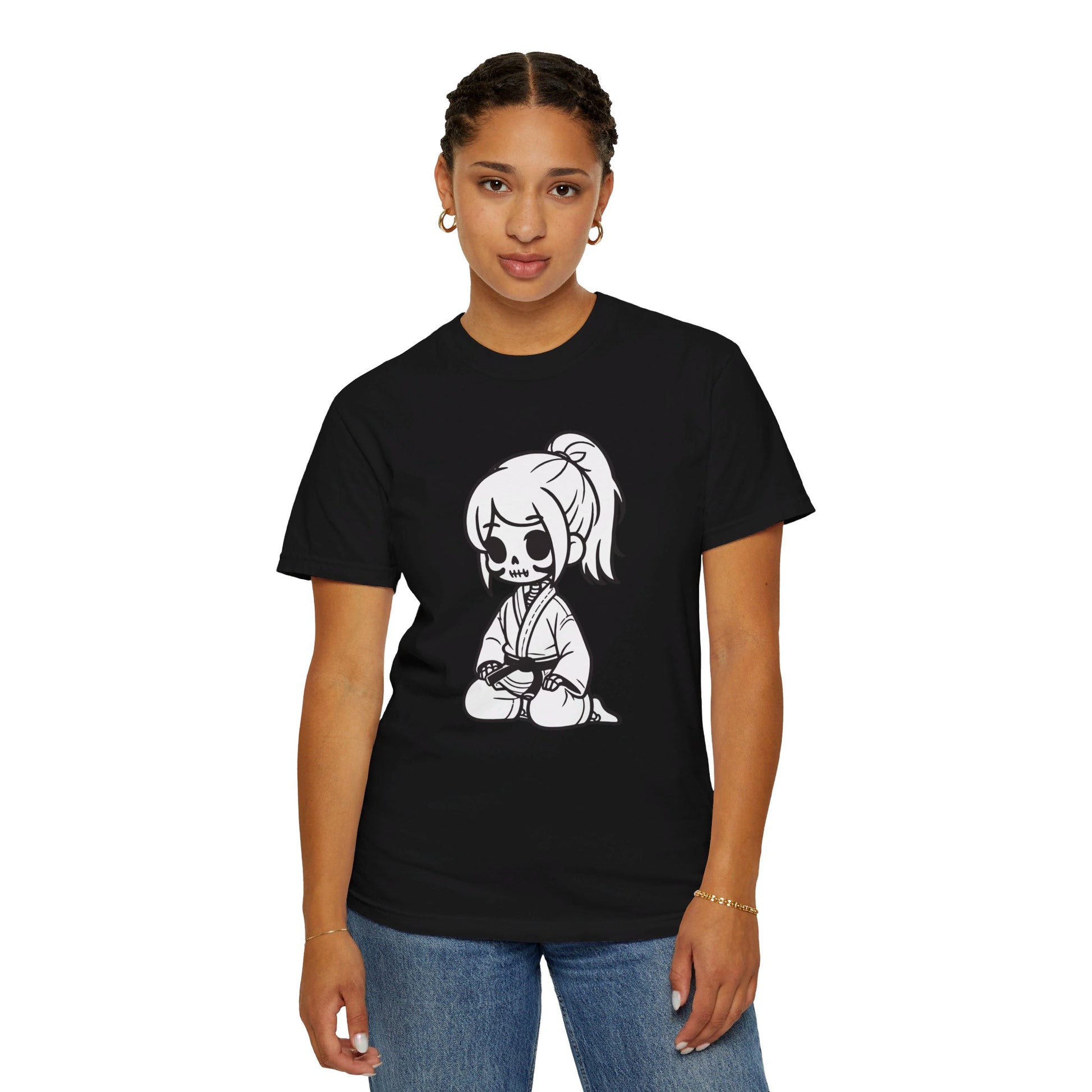 Front view of a woman wearing a black cotton t-shirt, with a design of a skeleton girl wearing a jiu jitsu gi printed on the front of the shirt.