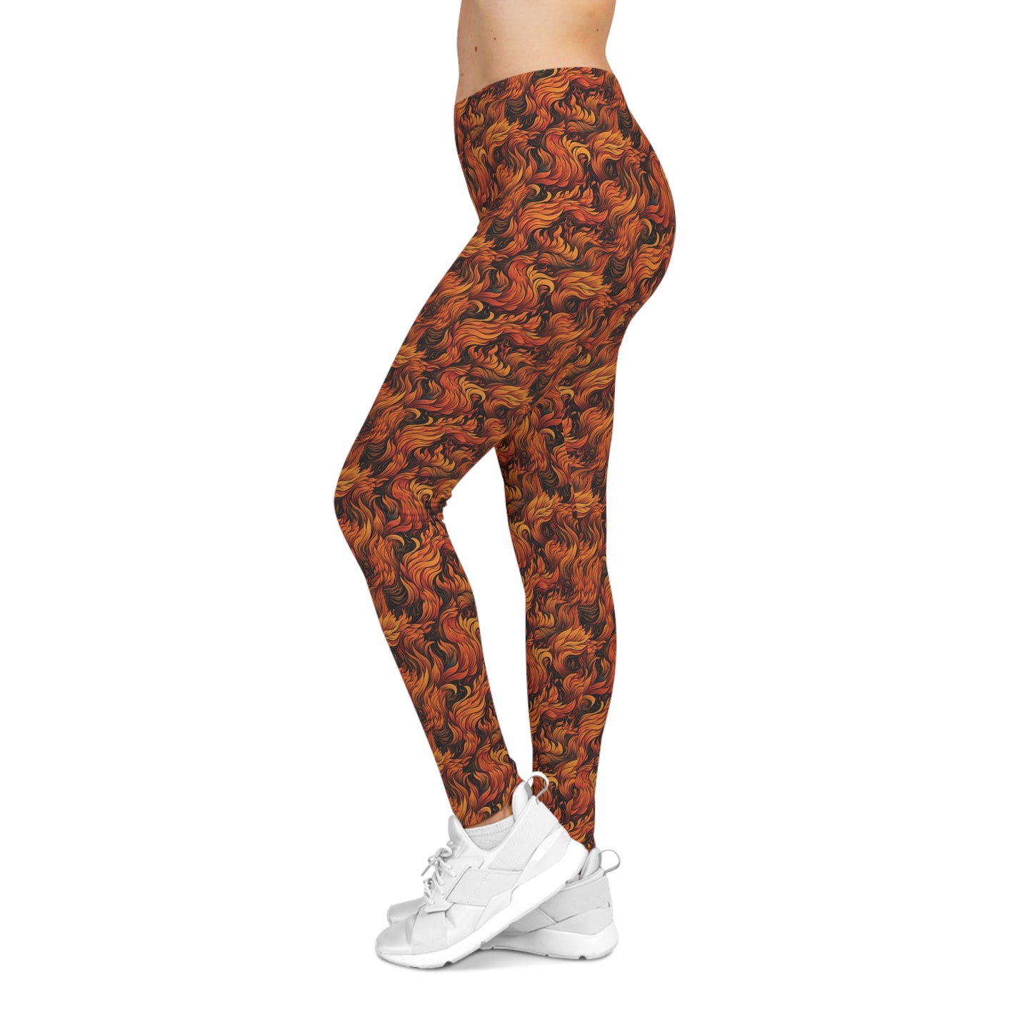 Left side view of a woman wearing low rise leggings with a fire and flames all-over-print.