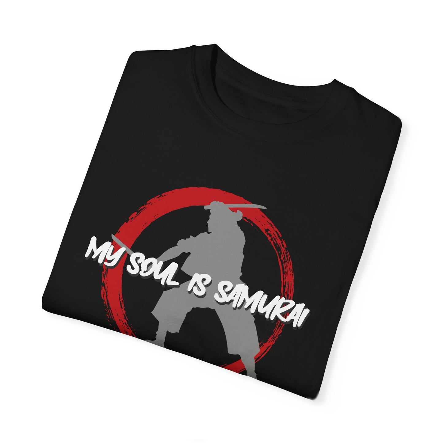 A folded, black cotton t-shirt with an enso symbol on the chest. Inside of the enso circle is a silhouette image of Miyamoto Musashi wielding two swords. Printed over both images is text that reads, "My soul is samurai".