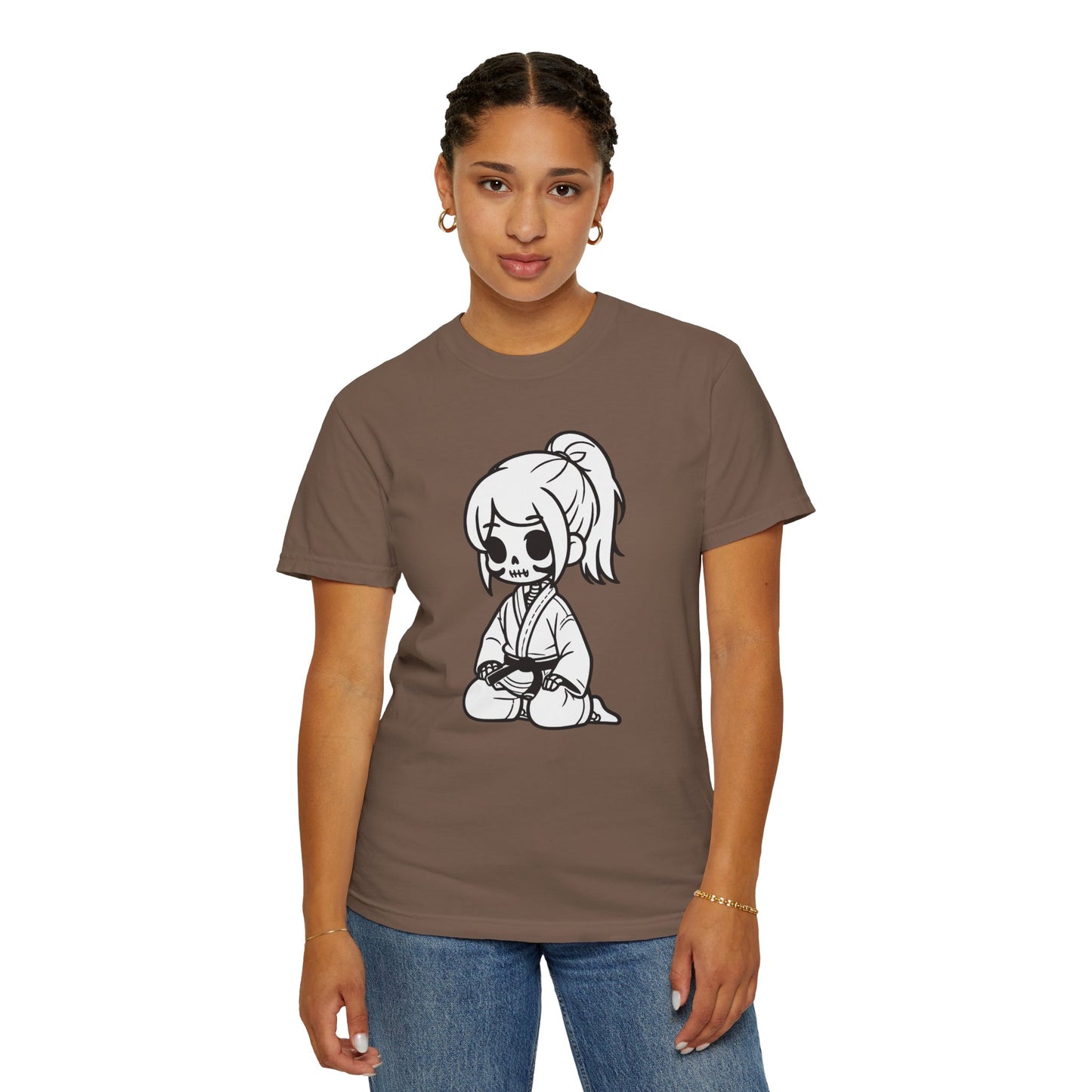 Front view of a woman wearing an Espresso colored cotton t-shirt, with a design of a skeleton girl wearing a jiu jitsu gi printed on the front of the shirt.