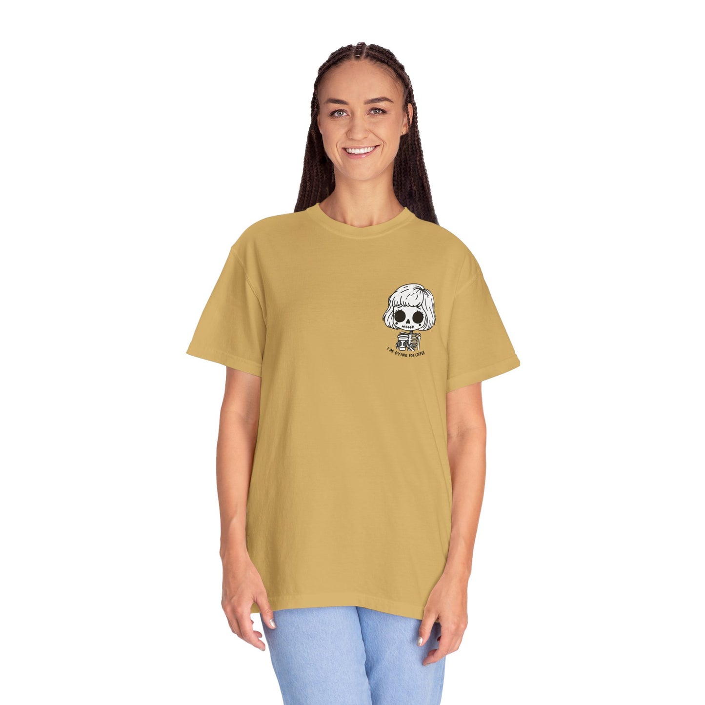 Alternate view of a tall, thin woman wearing a Mustard colored t-shirt with a design of a skeleton girl holding a cup of coffee printed on the front. Written underneath the design is the text, "I'm dying for coffee". The design is placed on the left chest area of the t-shirt.