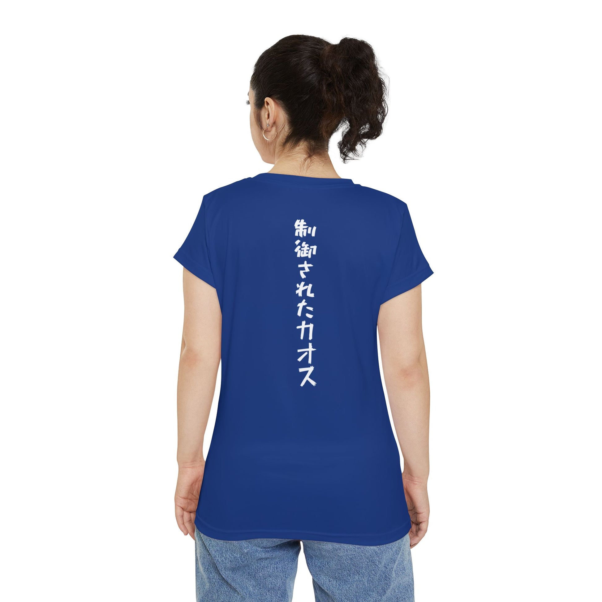 Back view of a woman wearing a dark blue, polyester blend t-shirt, with the words "Controlled Chaos" written vertically down the middle of the shirt in Japanese.