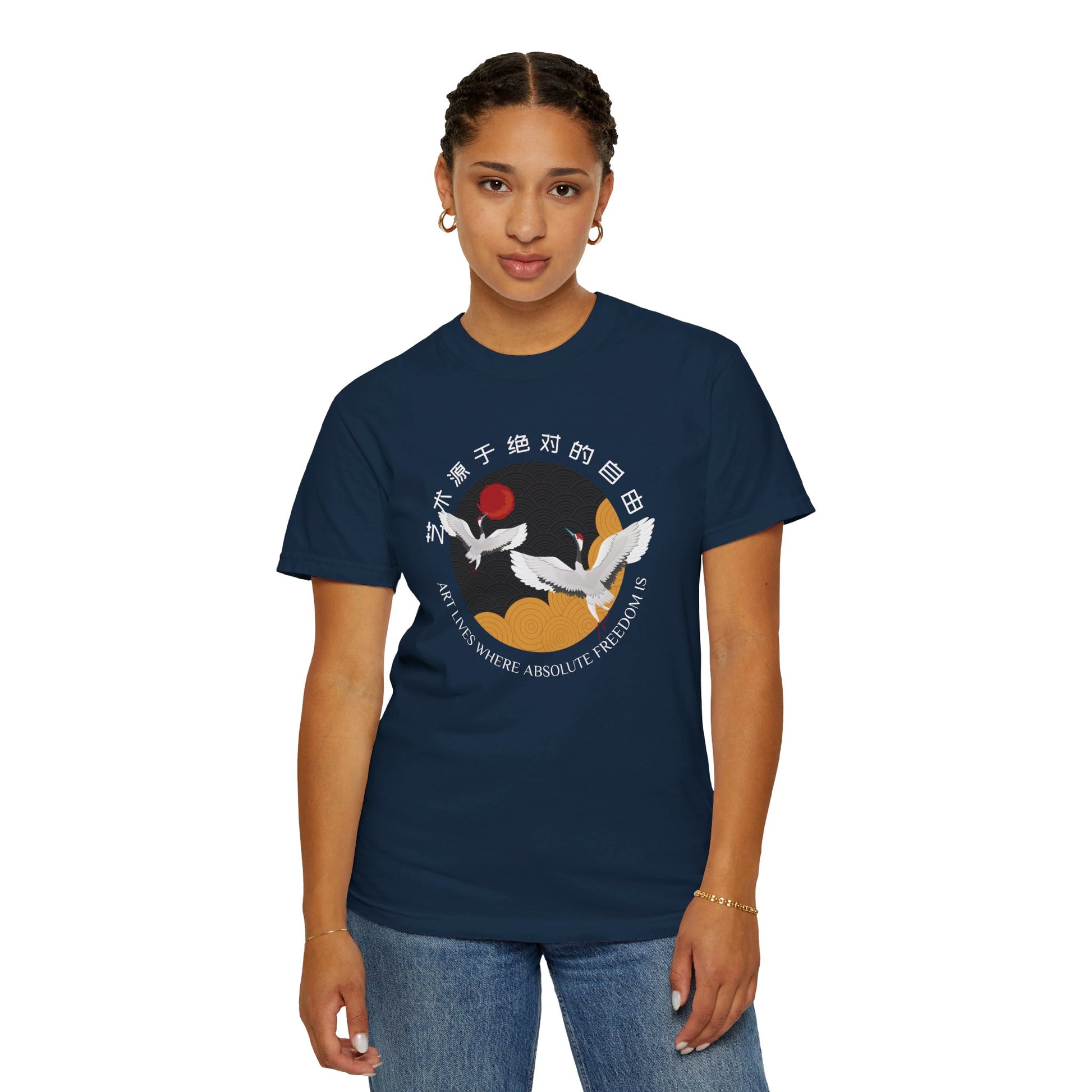 Woman wearing a navy blue t-shirt with design of two cranes flying, surrounded by the quote, "Art lives where absolute freedom is", written in both English and Mandarin.