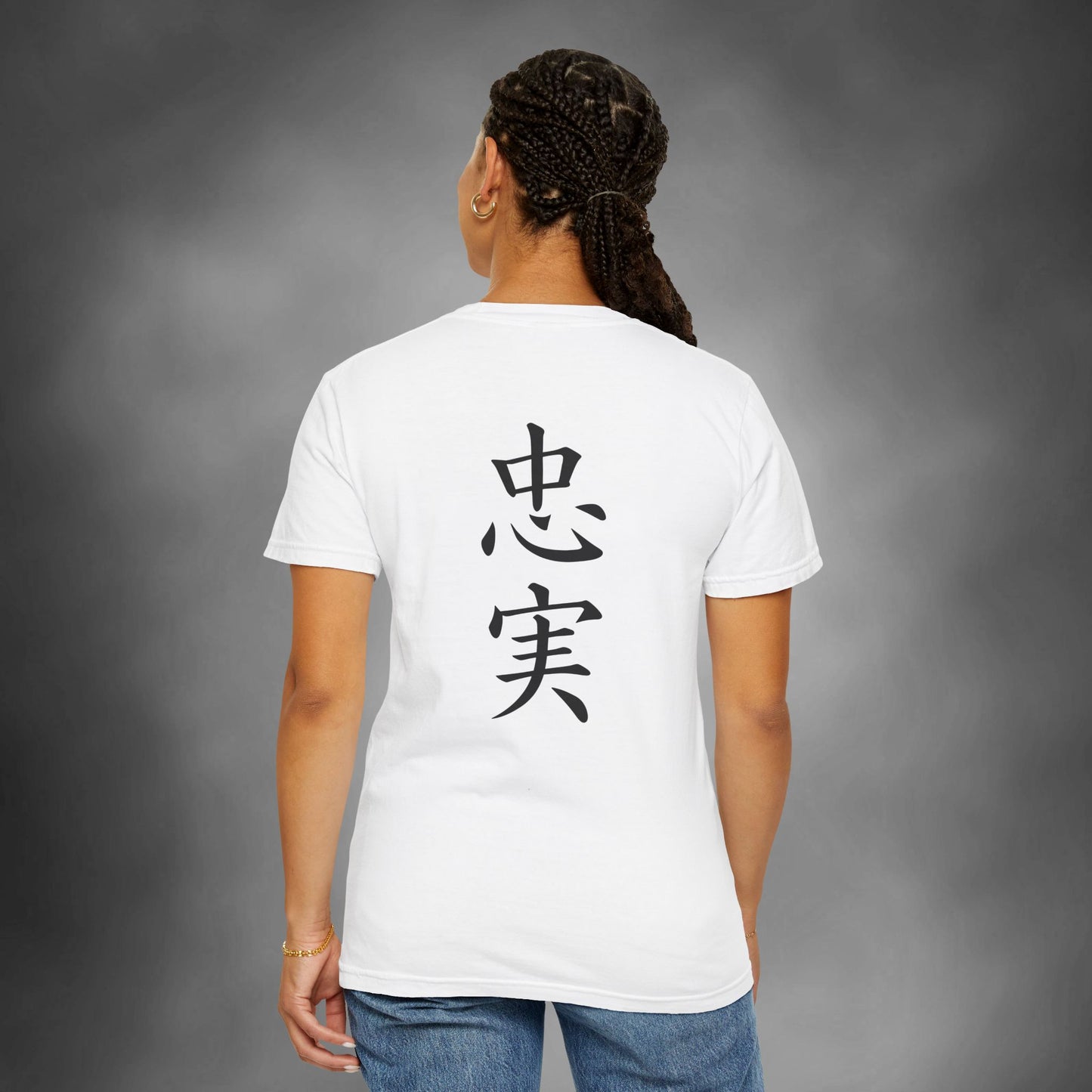 Back view of a woman wearing a white, cotton t-shirt with the kanji for "Loyal" printed vertically down the middle.