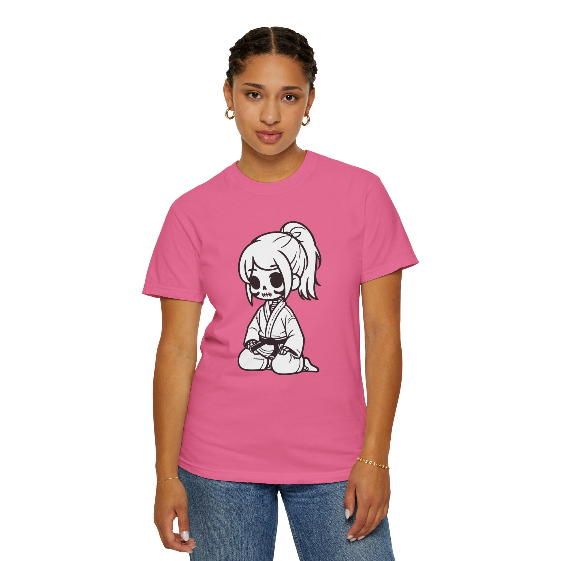 Front view of a woman wearing a Crunchberry colored cotton t-shirt, with a design of a skeleton girl wearing a jiu jitsu gi printed on the front of the shirt.