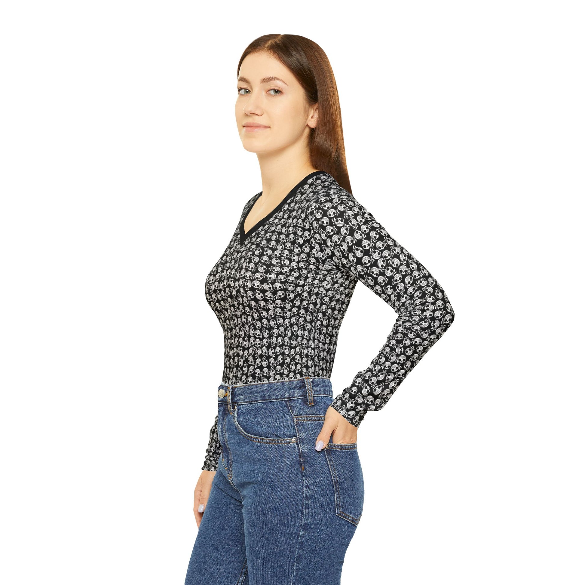 Left side view of a woman wearing a skull-patterned, polyester blend, long sleeve Women's v-neck shirt.