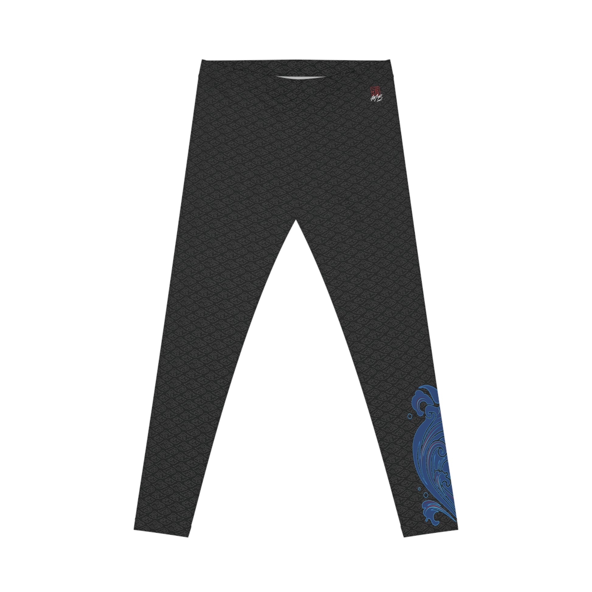 Front view of black, patterned low-rise leggings, with a small, abstract design on the left calf area.