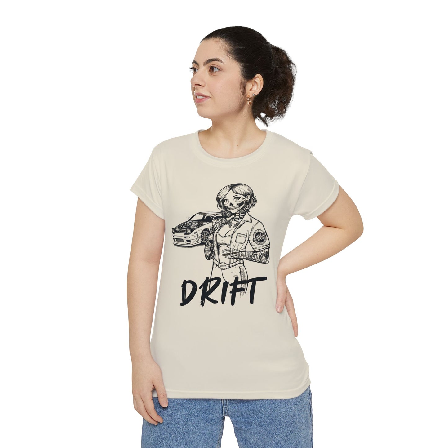 Front view of a woman wearing an off-white, polyester blend t-shirt, with a design of a female skeleton dressed as a mechanic. The mechanic is standing next to her car with the word "Drift" written underneath.