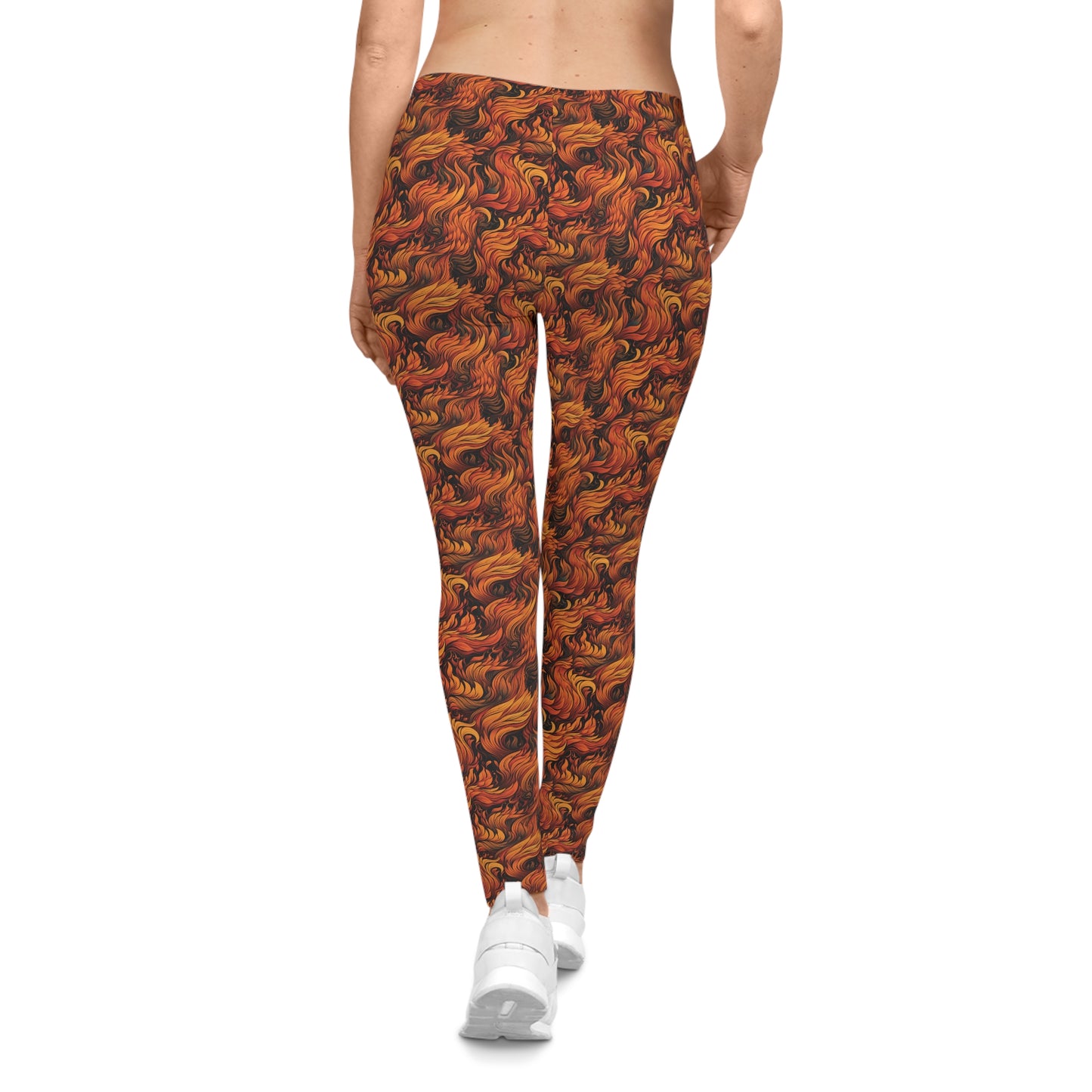 Back view of a woman wearing low rise leggings with a fire and flames all-over-print.