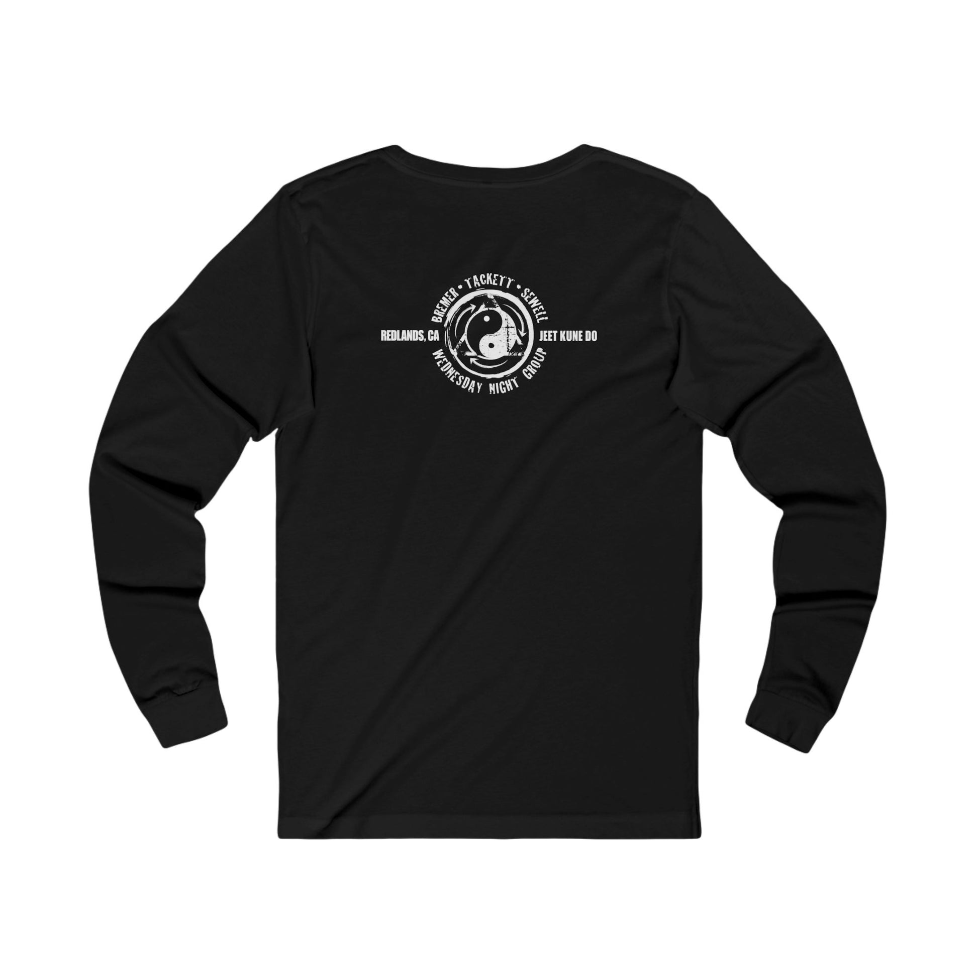 Back view of a black cotton, long sleeve t-shirt, with the JKD Wednesday Night Group logo printed on the upper back area.