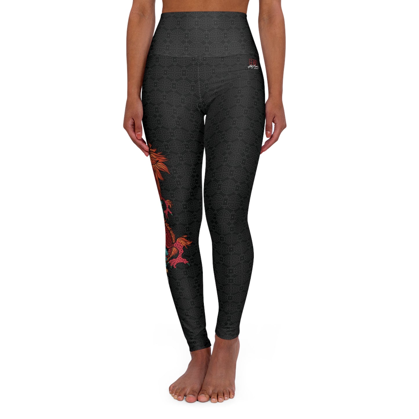 Front view of black, patterned yoga leggings with a large design of a dragon wrapped around a sword. The design is placed vertically on the right leg.