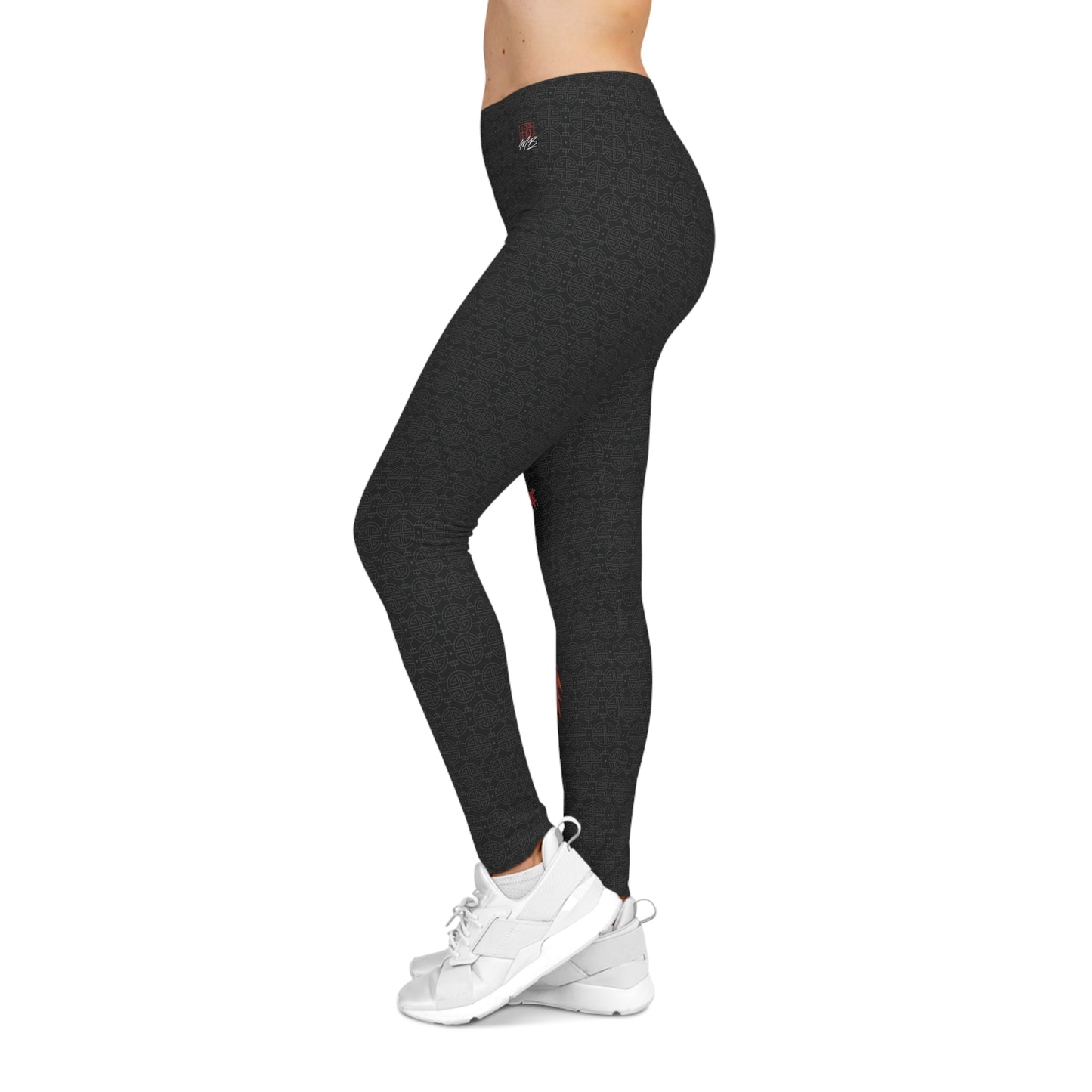 Left side view of black, patterned low-rise leggings.