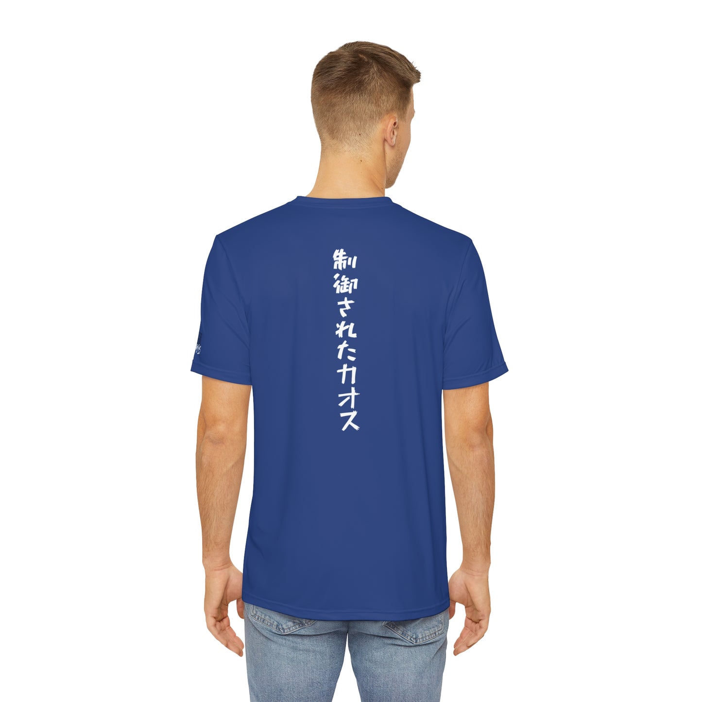 Back view of a man wearing a dark blue t-shirt, with the words "Controlled Chaos" written vertically down the middle of the shirt in Japanese.