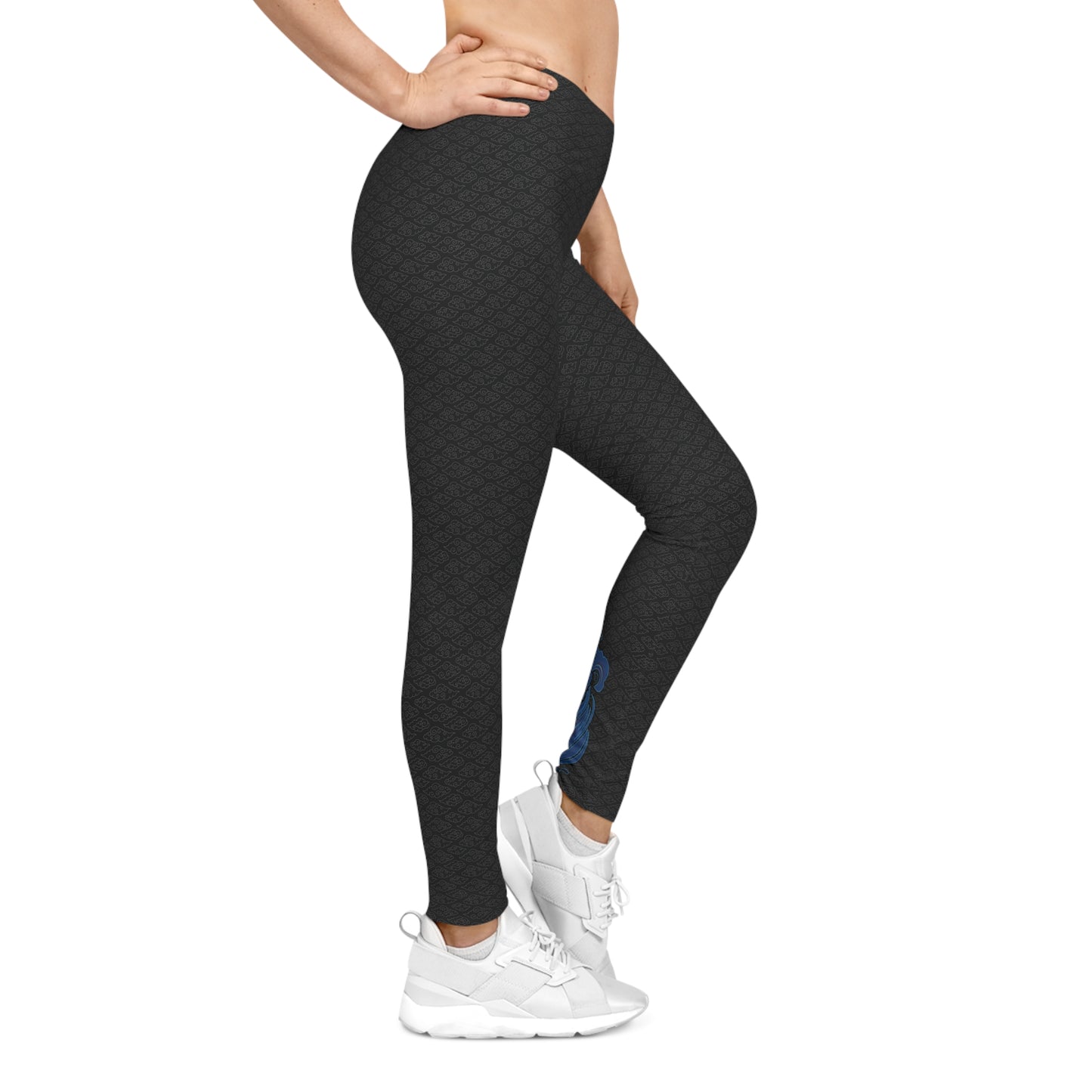 Right side view of black, patterned low-rise leggings.