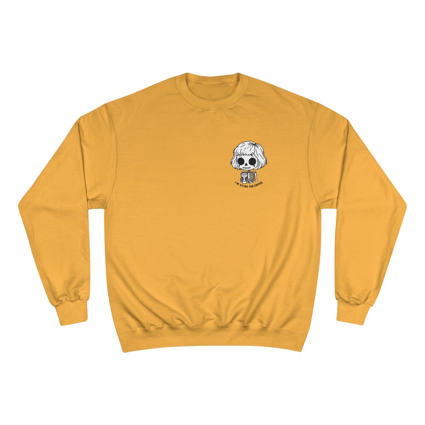 Front view of a gold colored sweatshirt with a design of a skeleton girl holding a cup of coffee. Written underneath is the text "I'm dying for coffee". The design is placed on the left chest area of the sweatshirt.