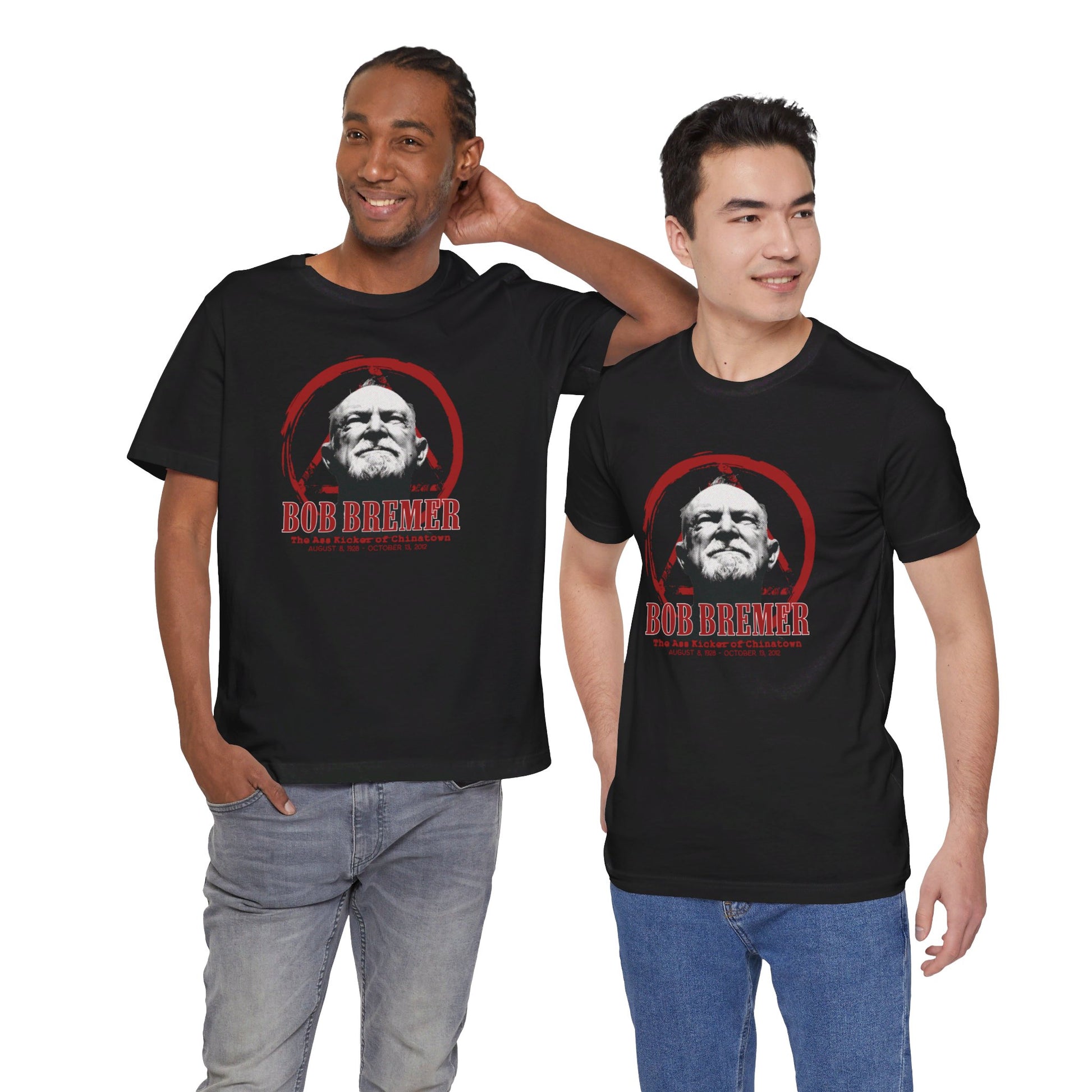 Front view of two men standing next to one another, wearing black cotton t-shirts, with images of first-generation Bruce Lee student Bob Bremer on the front.