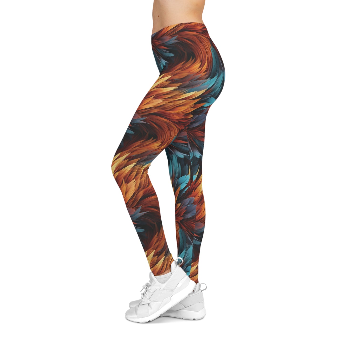 Left side view of a woman wearing aqua and orange colored, feather print low rise leggings.