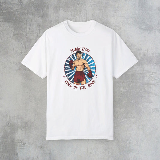 White cotton t-shirt with an illustration of a Thai boxer in the center of the chest. Written around the illustration is the text, "Muay Thai - King of the Ring".