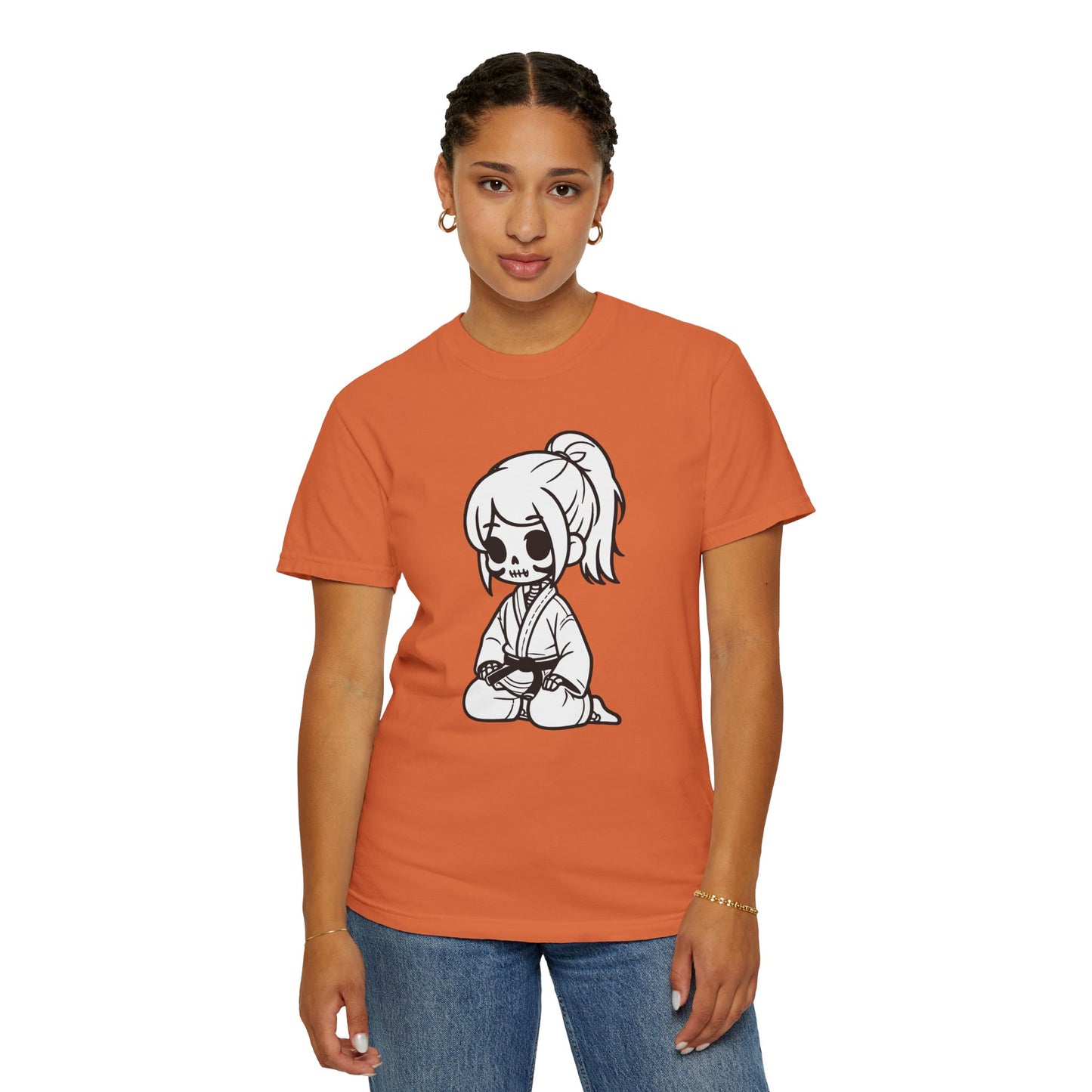 Front view of a woman wearing a Burnt Orange colored cotton t-shirt, with a design of a skeleton girl wearing a jiu jitsu gi printed on the front of the shirt.